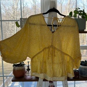 Yellow floral blouse with a tie front and back
